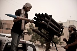 Libya rebels loading rockets
