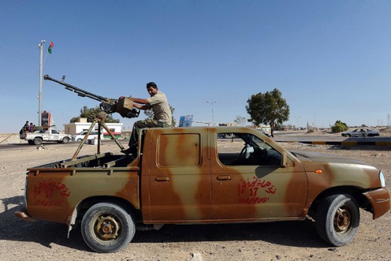 Libyan rebel on top of pickup truck
