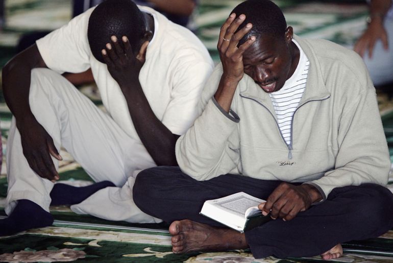 Muslims African migrants pray during the Friday''s prayer at a Mosque near the CETI