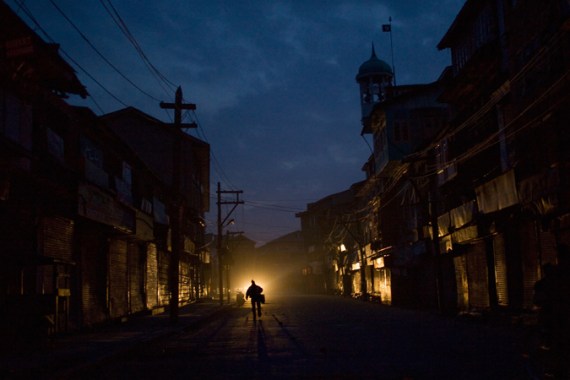 Man running down street in Srinagar