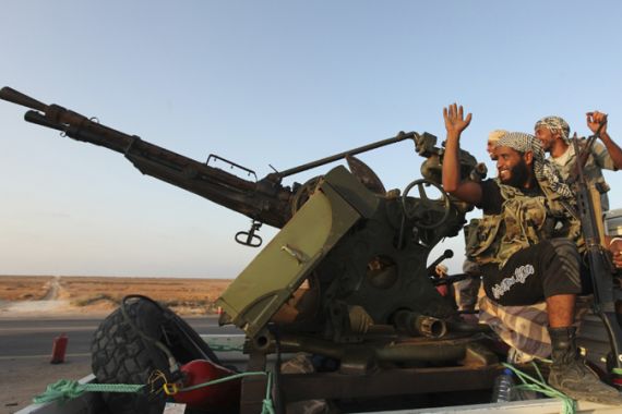 Libyan rebels on tank