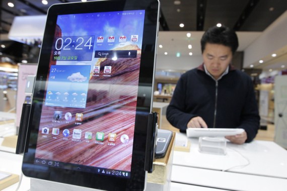 A man uses Samsung Electronics'' tablet Galaxy Tab 10.1