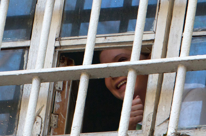 Tymoshenko is seen through a prison window in Kiev November 4, 2011 [Inna Sokolovska/Reuters]