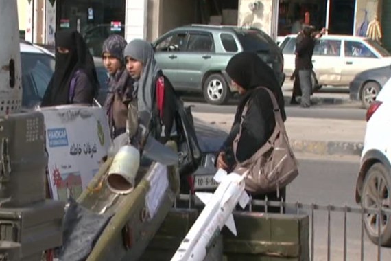 Libyans display cluster bombs at roadside exhibit
