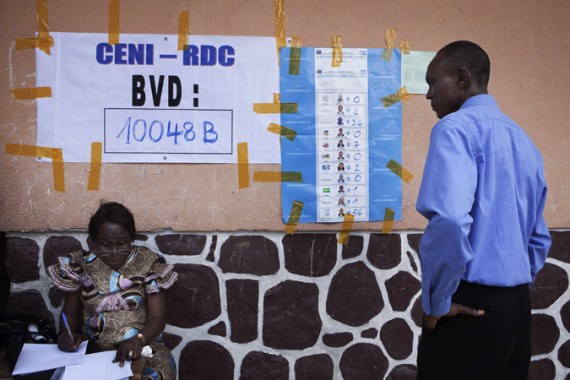 A man looks at results from a single polling station posted on a wall as an official makes notes in Democratic Republic of Congo''s capital Kinshasa, November 29, 2011. First results emerged from the Democratic Republic of Congo''s chaotic elections on Tuesday but some voters were still casting their ballots in a vote tainted by confusion, violence and allegations of fraud. REUTERS