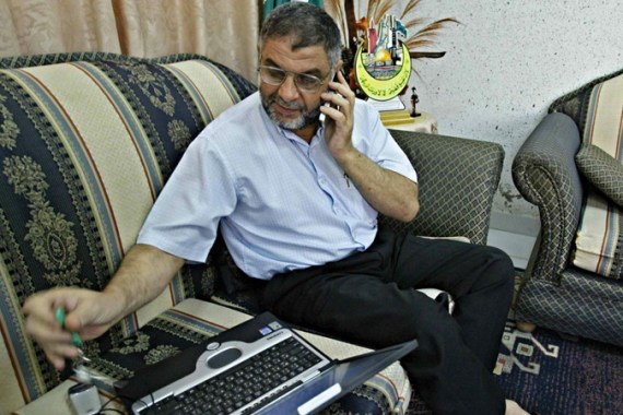 hamas leader with phone and laptop