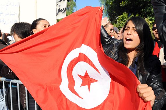 Tunisia protester with flag