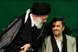 Khamenei talking to Iranian President Mahmoud Ahmadinejad