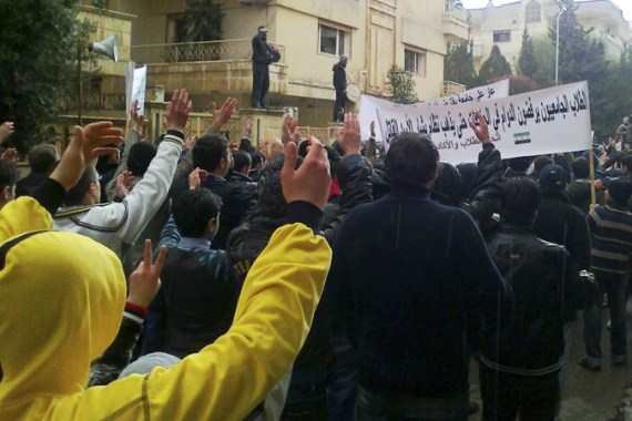 Demonstrators protest against Syria''s President Bashar al-Assad in Homs January 9, 2012. The banner reads: "University students refuse study, till the Assad regime steps down". Picture taken January 9. REUTERS