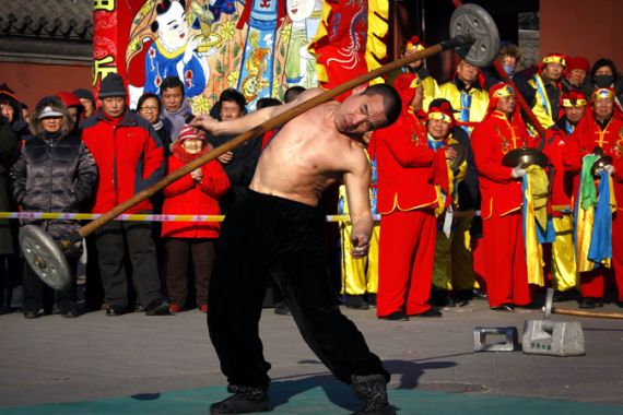 China New year strongman performer in Beijing