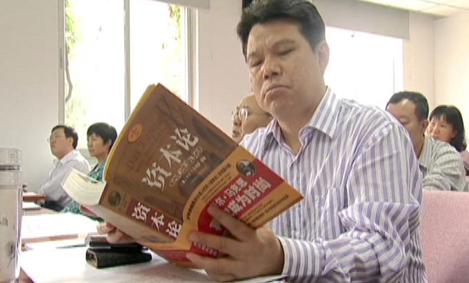 China Beijing communist party member reading Asia Asian