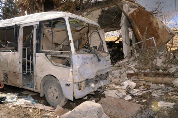 A damaged vehicle is seen outside the police headquarters building, one of two bomb blasts sites in Syria''s northern city of Aleppo February 10, 2012, i