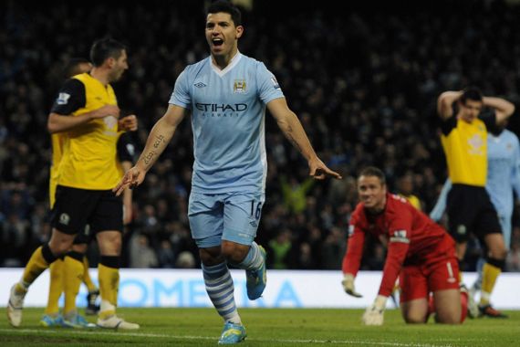Manchester City''s Sergio Aguero (C) celebrates scoring against Blackburn Rovers during their English Premier League soccer match in Manchester, northern England February 25, 2012. REUTERS