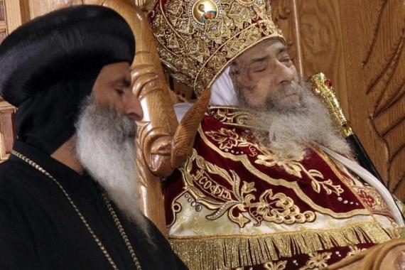 The body of Pope Shenouda III, the head of Egypt''s Coptic Orthodox Church, is displayed for public viewing inside the Abassiya Cathedra in Cairo