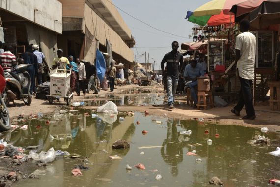 The open gutters of Colobane market show Senegal''s new president has much work ahead of him [Azad Essa/Al Jazeera]