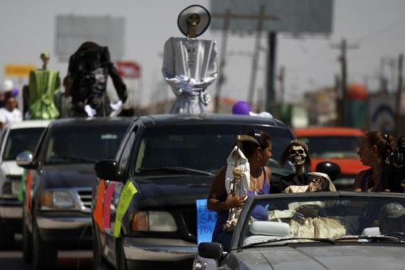 Depictions of La Santa Muerte, or the Saint of Death, are displayed during a rally in Ciudad Juarez