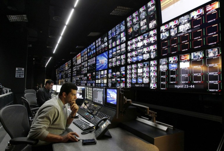 People work in the News Operation Center (NOC) at the Sky News Arabia studios in Abu Dhabi