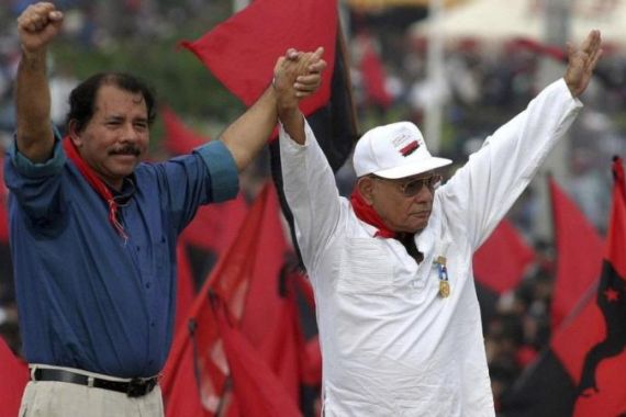 File photo of Nicaragua''s President Ortega and Borge, founder of FSLN, wave to supporters in Managua