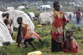 Newly arrived refugee children from the DRC play outside their makeshift refugee camp at Bunagana near Kisoro town