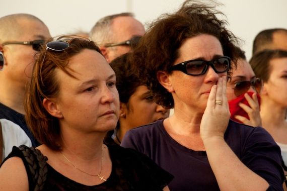 Villagio vigil: Women crying
