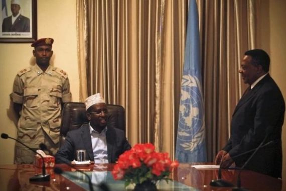 U.N. Special Representative for Somalia Augustine Mahiga talks with Somalia''s President Sheik Sharif Sheik Ahmed after his arrival in the capital Mogadishu