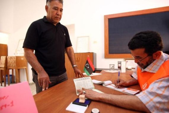 A Libyan man registers for the upcoming
