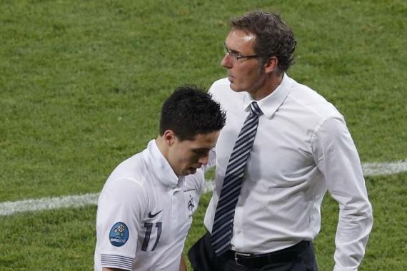 France''s Nasri passes by the coach Blanc as being substituted during the Group D Euro 2012 soccer match against Sweden in Kiev