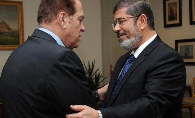 Muslim Brotherhood''s President-elect Mohamed Mursi is greeted by Egypt''s Prime Minister Kamal Ganzouri at the Presidency in Cairo