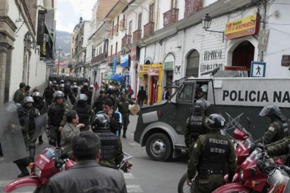 Riot policemen stationed at corner of Murillo square where Bolivia''s presidential palace is located