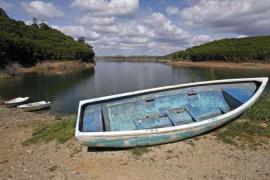 Boat is seen out of water during a draught on the dam reservoir of Santa Clara a Velha in Southern Portugal