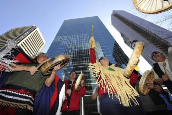 First nations natives from British Columbia protest in front of the headquarters of Enbridge before the company''s annual general meeting in Calgary.