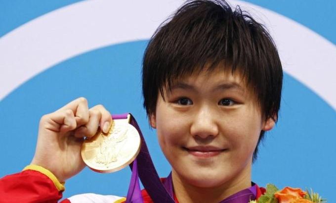 File photo of China''s Ye Shiwen posing with her gold medal on the podium during the women''s 400m individual medley victory ceremony at the London 2012 Olympic Games