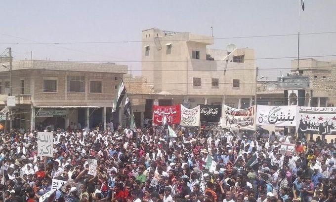 Demonstrators protest against Syria''s President Bashar al-Assad in Binsh near Idlib