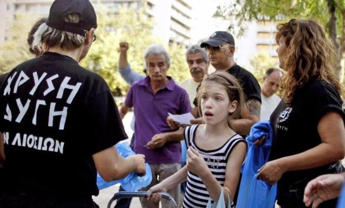 Members of Greek ultra right wing party Golden Dawn distribute food products to Greek citizens in central Athens, Greece