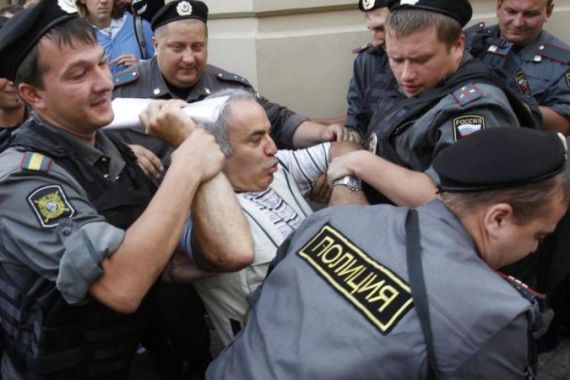 Police detain former world chess champion and opposition leader Kasparov during the trial of the female punk band
