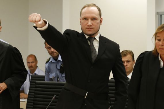 Breivik gestures as he arrives at Oslo court