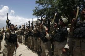 Afghanistan security forces celebrate their victory after a Taliban attack near Kabul