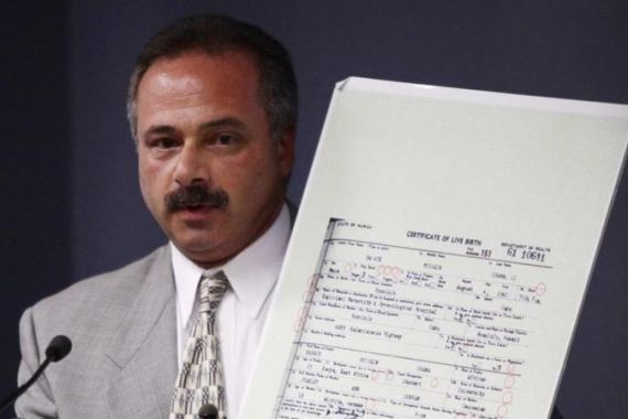 Cold Case Posse and investigator Zullo holds up a copy of President Barack Obama''s long-form birth certificate as he speaks during a news conference at the Maricopa County Sheriff''s Office Training Center Auditorium in Phoenix