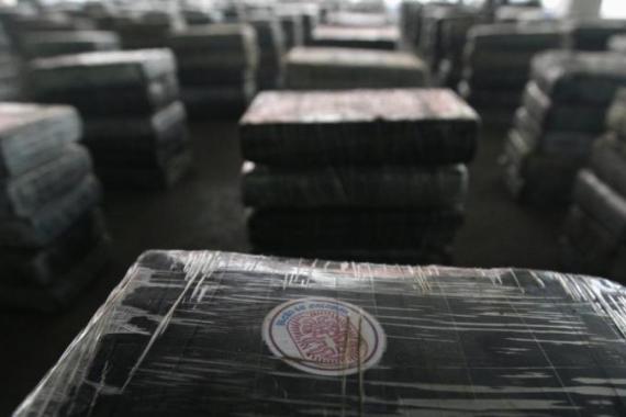Packages of seized cocaine are seen with a sticker that reads