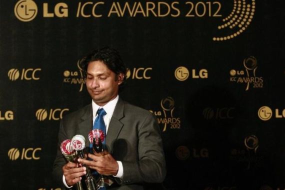 Sri Lanka''s Sangakkara poses with his trophies during the ICC Awards in Colombo