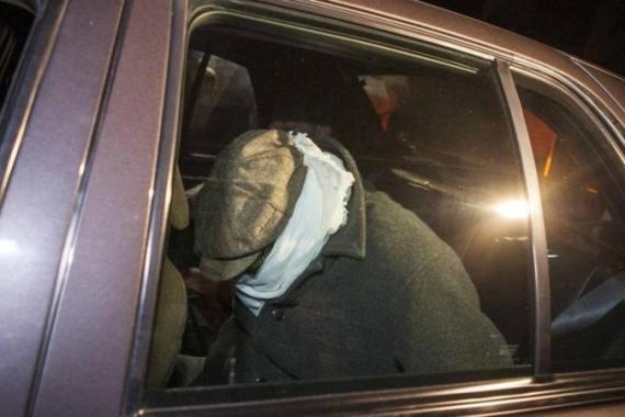 Unidentified person is escorted in a Los Angeles County Sheriff''s vehicle from Nakoula Basseley Nakoula''s home by officers in Cerritos, California