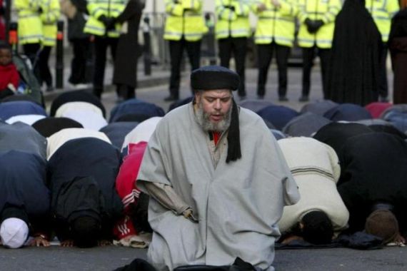 File photograph shows Muslim cleric Abu Hamza al-Masri leading prayers outside the North London Central Mosque, in north London