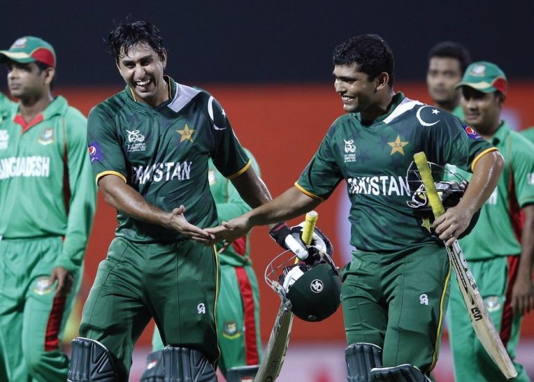 Pakistan''s Akmal and Jamshed share a moment after winning the match against Bangladesh during their Twenty20 World Cup cricket match in Pallekele