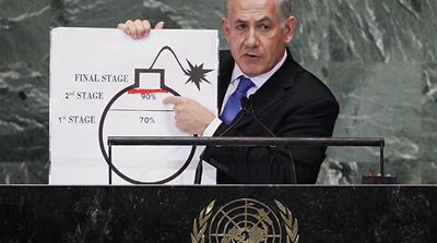 Israeli Prime Minister Benjamin Netanyahu points to a cartoon bomb representing Iran's nuclear programme at the UN General Assembly in September 2012 [Lucas Jackson/Reuters]