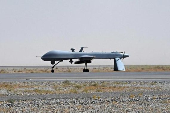 File photo of U.S. Predator unmanned drone armed with a missile on the tarmac of Kandahar military airport