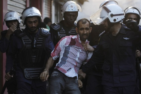 Bahraini anti-riot police detain man in protest