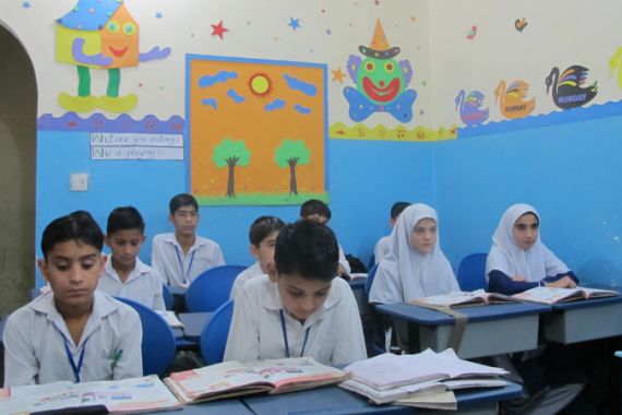 IMG_0735: Students studying an English lesson at the Parwarish School and Hostel [Minhajuddin/Al Jazeera]