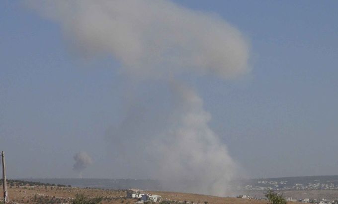 Smoke rises after a Syrian Air Force fighter jet loyal to Syria''s President Bashar al-Assad fired missiles at Marat Harma