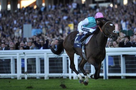 Tom Queally riding Frankel (R) goes on t