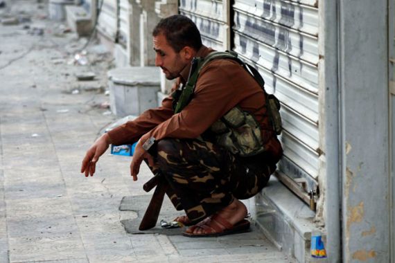 A Free Syrian Army fighter takes a break in Aleppo.